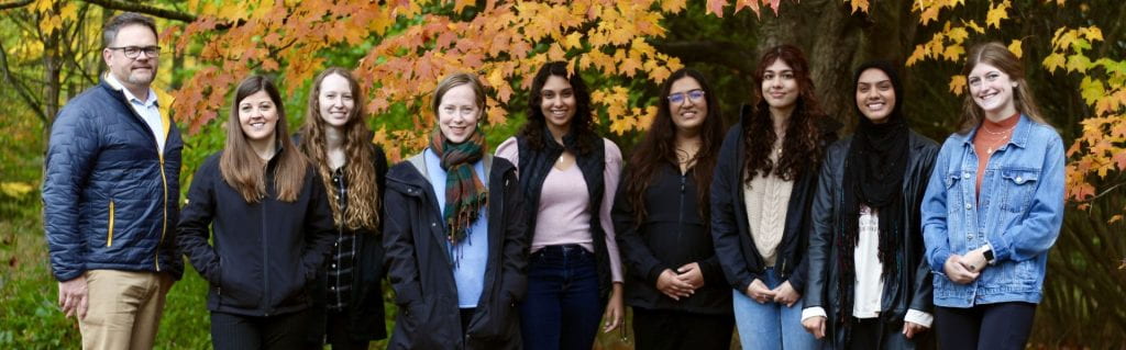 RCVM@OVC team posing for a photo among fall leaves in Arboretum at U of G.