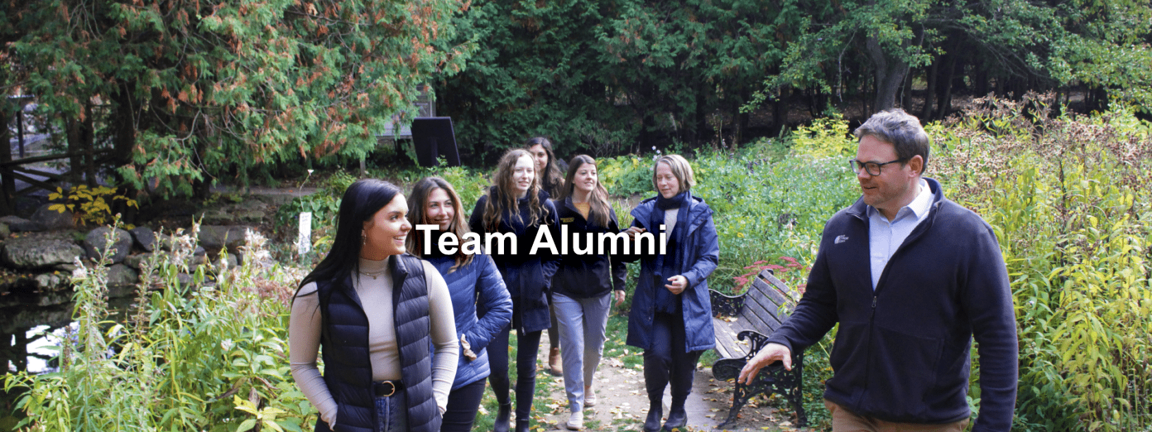 RCVM@OVC alumni and current team members walking through a wooded area in the Arboretum, University of Guelph