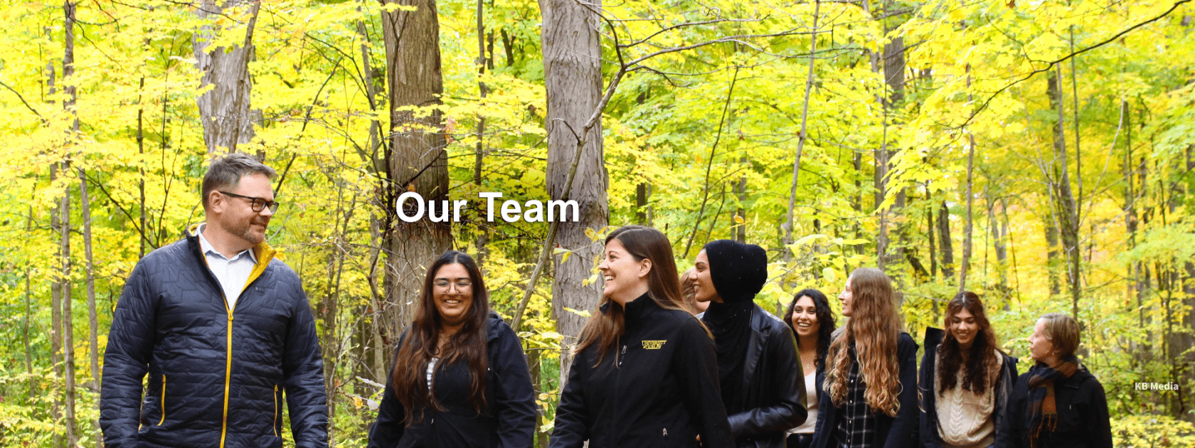 RCVM@OVC current team members walking through a wooded area in the Arboretum, University of Guelph